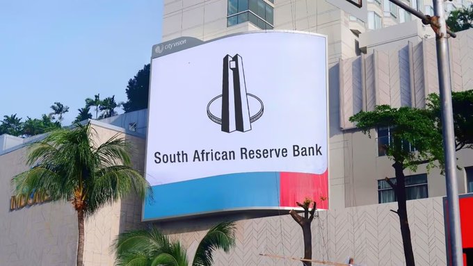 A large sign outside the South African Reserve Bank building reads "South African Reserve Bank," with its distinctive logo, reflecting the context of South Africa's proposed restrictions on outbound cryptocurrency transfers and the concerns raised by exchange VALR.