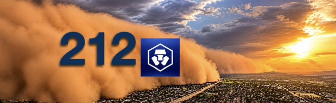 A banner displaying '212' next to a blue shield icon, overlaid on an image of a massive dust cloud with a town in the distance at sunset.