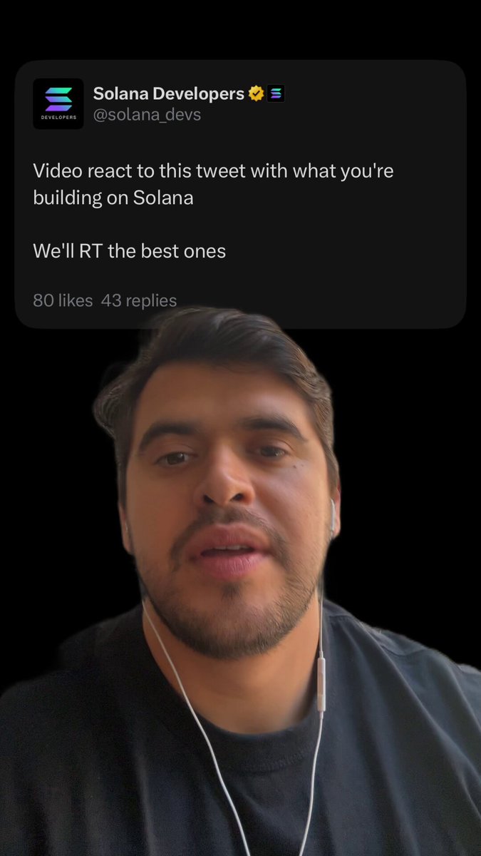 The image shows a man wearing headphones, possibly listening to music or participating in an online meeting. He has a beard and is dressed in a black shirt. The background of the image is dark, which contrasts with the white text that reads "Video react to this tweet with what you're building on Solana". This post seems to be about a video game called "Solana" developed by @solana developers.