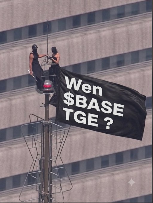 Two people on a platform attached to a tall structure unfurling a black banner reading 'Wen $BASE TGE ?' in white text against a building backdrop.
