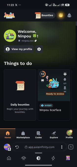 The image shows a phone screen displaying an app called "Silent but still playing @axixinfinity" with a message that reads "@AxixInfinity Silent but still playing @axixinfinity". The app appears to be a music streaming service, and there is a list of songs on the screen. The post in question seems to be about the evolution of an old MEO (Music Evolution Online) game called "MEO axi" that was released on Monday.