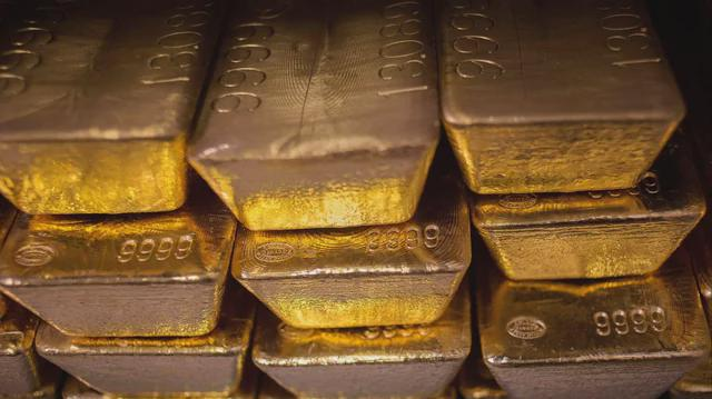 The image shows a large stack of gold bars, with each bar having the number "9988" printed on them. The bars are neatly arranged in a pyramid-like structure, showcasing their golden hue. The text in the image reads "Fellow degens, please sell the gold in your hands and buy $BTC." This message is likely intended to encourage people to invest in the gold market or to promote the sale of these gold bars for a specific currency exchange rate.

The image focuses on the gold bars themselves, with no other objects present. The arrangement of the bars creates an impressive visual effect that highlights their value and appeal as an investment opportunity.