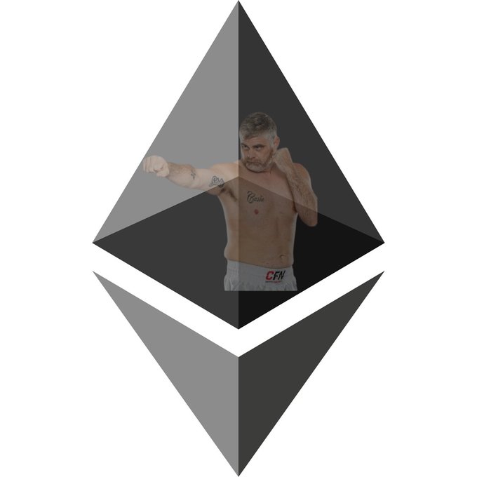 The Ethereum logo (a diamond-shaped octahedron) with a shirtless man wearing boxing gloves and grey CFN shorts superimposed in the center.