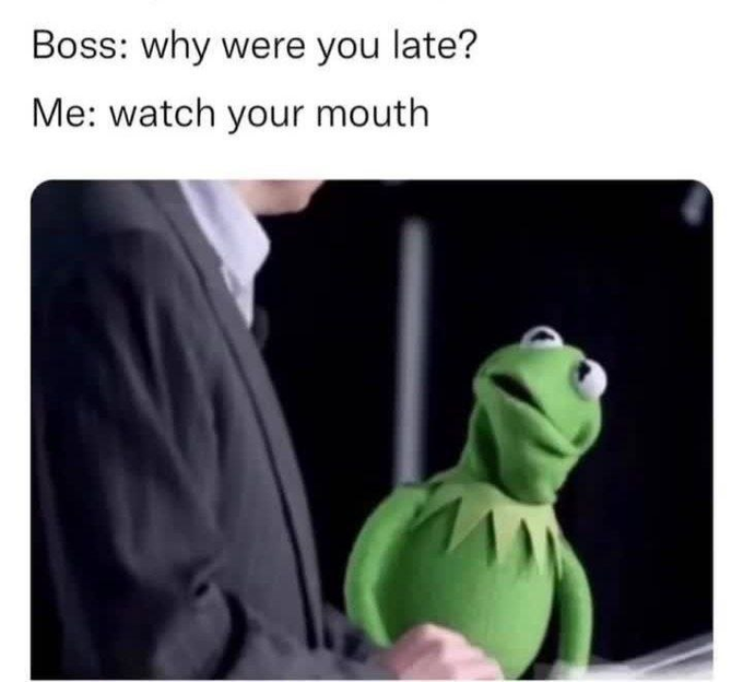 The image features a person wearing a suit, standing next to a green stuffed animal that appears to be a Kermit the Frog character from Muppets. The text "Boss: why were you late? Me: watch your mouth" is displayed above the scene. This suggests that someone has posted this image on social media with a humorous caption about a situation involving a person and a toy character, possibly related to work or an event.