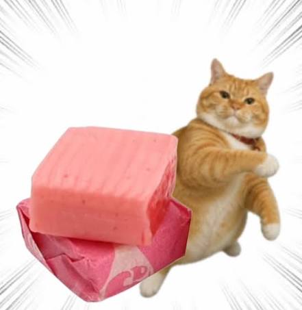 An orange tabby cat with one paw raised, appearing to pose next to a pink eraser or block in front of a white background with black radial lines.