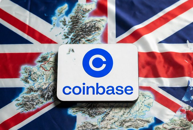 Photo of a white 'coinbase' sign with the blue logo, placed over a British Union Jack flag with an embossed map of the UK and Ireland.