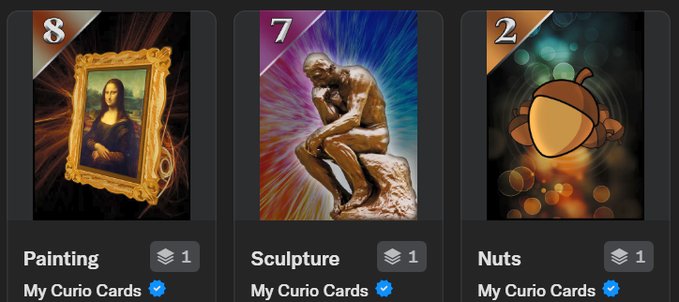 Three digital collectible cards from Curio displayed on a dark interface: a 'Painting' card (value 8) showing the Mona Lisa, a 'Sculpture' card (value 7) showing Rodin's The Thinker, and a 'Nuts' card (value 2), all labeled 'My Curio Cards'.