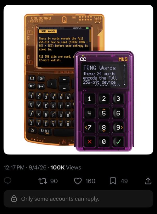 A social media post timestamped 12:17 PM, 9/4/26 showing two transparent cryptocurrency hardware wallets (Coldcard Q in orange and Mk5 in purple) displaying 'TRNG Words' and 'These 24 words encode the full 256-bit device seed' text, with 100K views.
