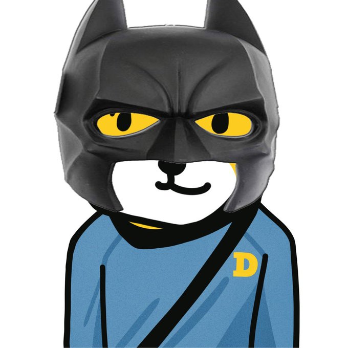 This image depicts a Dogecoin character dressed as Batman, complete with the iconic cowl and a blue shirt featuring the Dogecoin "D" logo. The caption "Holy Candle Batman!" plays on the familiar Batman catchphrase, suggesting a significant or exciting event, likely related to the Dogecoin cryptocurrency's performance as indicated by the "candle" reference often used in stock/crypto trading.