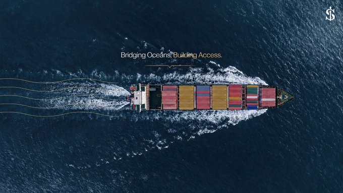 An aerial view of a container ship loaded with colorful shipping containers sailing across the ocean, overlaid with the text "Bridging Oceans. Building Access."

The image complements the post's theme by using global shipping as a visual metaphor for connecting markets and delivering real-world utility—contrasting the Web3 norm of speculative tokens with the tangible, infrastructure-driven value creation seen in established industries like maritime trade.
