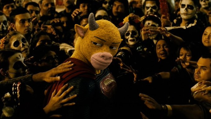 A figure wearing a yellow bull mask and a red cape stands surrounded by a crowd of people painted in skull-like makeup, evoking a Day of the Dead festival atmosphere. The bull imagery ties directly to the post's "Niu Lai" (牛来) reference, symbolizing a bullish market surge arriving amid a sea of "skeletal" bearish sentiment.