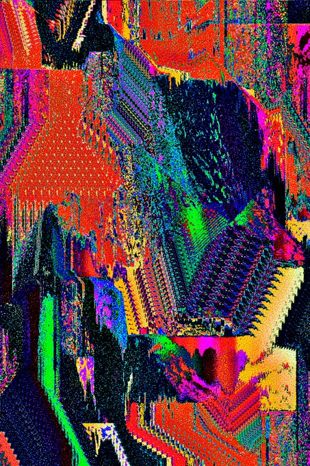A heavily distorted, glitch-art style image with vibrant neon reds, greens, blues, and purples creating a chaotic pixelated pattern.