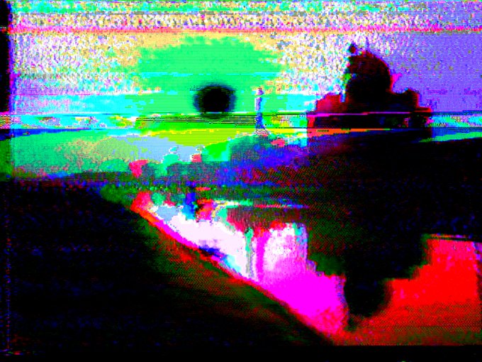 A heavily distorted, glitch-art landscape featuring a dark sun, silhouetted trees, and a bright magenta-red foreground, rendered in analog VHS-style color bleeding and scanline artifacts that embody the "DEAD AIR 39" title's retro broadcast interference aesthetic. The abstract, signal-corrupted composition evokes a lost transmission from an old videotape, mirroring the fragmented digital token available on objkt.com.