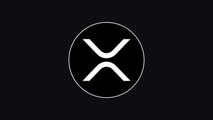 A black circular logo featuring a stylized white 'X' design on a dark gray background, associated with the XRP cryptocurrency.