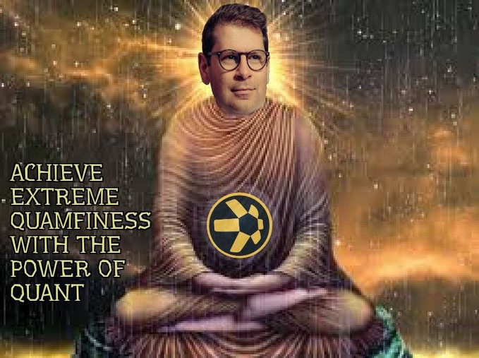 A meme image showing a man with glasses meditating in lotus position with the caption "ACHIEVE EXTREME QUAMFINESS WITH THE POWER OF QUANT," featuring a circular logo resembling the Quant (QNT) cryptocurrency symbol on his chest.