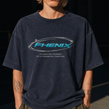 A person wears an oversized vintage-style "PHENIX" graphic t-shirt featuring the tagline "AN ENCRYPTIVE MOVEMENT FOR CONFIDENTIAL COMPUTING" in a bold, futuristic font. The worn, faded look of the shirt fits the "dripped out in cryptography" post, as Phenix is a real privacy-focused digital currency, blending retro streetwear aesthetic with crypto culture.