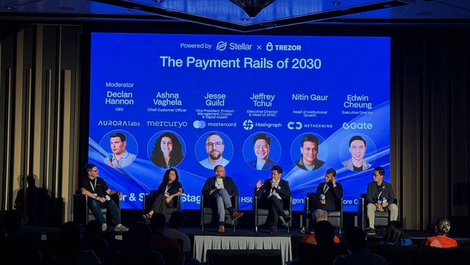 A panel discussion titled 'The Payment Rails of 2030' powered by Stellar and Trezor, featuring moderators and executives from Mastercard, Hashgraph, and other companies.