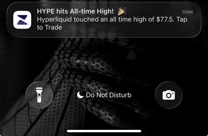 A phone notification from 'Z' (likely a crypto app) reading 'HYPE hits All-time High! 🎉 Hyperliquid touched an all time high of $77.5. Tap to Trade', displayed over a dark background with 'Do Not Disturb' activated.
