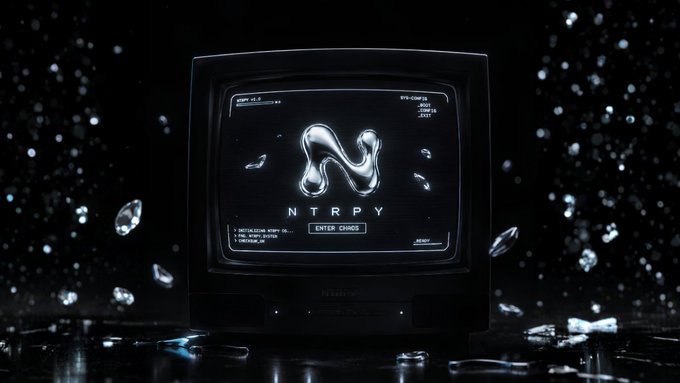 A retro-style television screen displays the letters 'NTRPY' below a metallic, fluid-like logo, set against a dark background with floating diamond shapes.