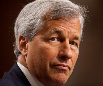 The image shows a man wearing a suit, with his face turned towards the camera. The caption reads "BREAKING: CEO of Ripple - Brad Garlinghouse went LIVE on FoxBusiness and didn't hold back. He called Jamie Dimon' s crypto criticism an  INTENTIONAL MISREPRESENTATION FOR DECADES.".