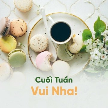 A plate of colorful macarons arranged around a cup of black coffee is displayed on a white surface, with the Vietnamese text 'Cuối Tuần Vui Nha!' (Happy Weekend!) overlaid at the bottom.