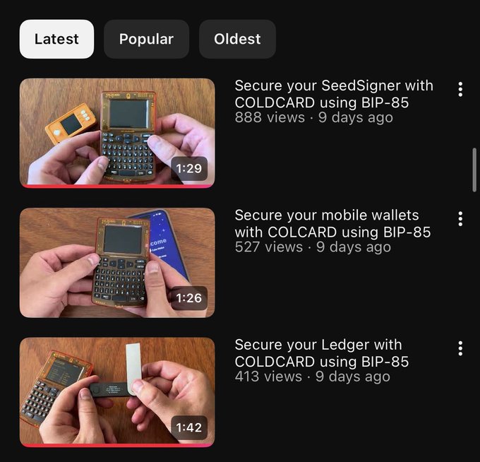 Mobile app interface showing a list of cryptocurrency tutorial videos about securing wallets (SeedSigner, mobile wallets, Ledger) with COLDCARD using BIP-85.