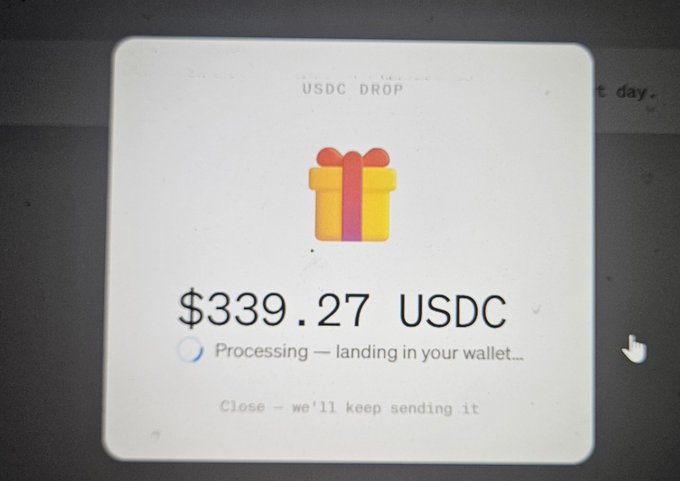 A digital pop-up notification shows a 'USDC DROP' of $339.27 USDC processing and landing in the user's wallet, with an option to close and keep sending it.