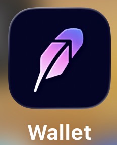 A dark blue app icon with a purple and pink feather design labeled 'Wallet'.