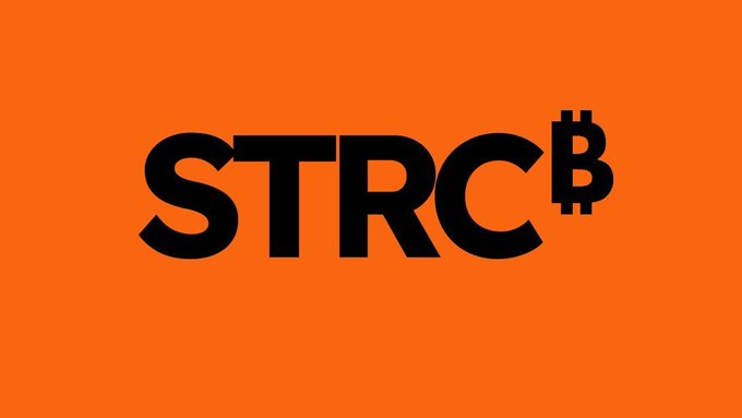The image features a striking orange logo with black text that reads "STRC" followed by "BTC", which stands for Bitcoin Trading Service. The text is capitalized, making it easily readable against the orange background. The bold font of the letters emphasizes the importance and relevance of the Bitcoin Trading Service in today's digital landscape.