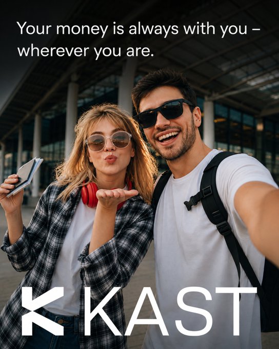 Advertisement for KAST with text 'Your money is always with you – wherever you are' showing a young couple taking a selfie while the woman blows a kiss, with the KAST logo at the bottom.