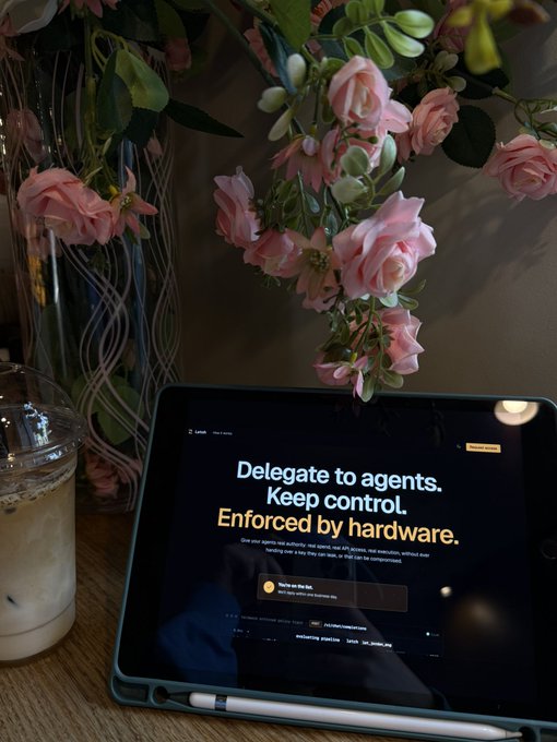 The image features an open tablet computer with a pink rose decoration above its screen. The tablet displays a message that reads "Delegate to agents. Keep control. Enforced by hardware." This message seems to be related to the post about real-world data and web connectivity, as it suggests using the tablet for managing and controlling access to certain information or resources.
