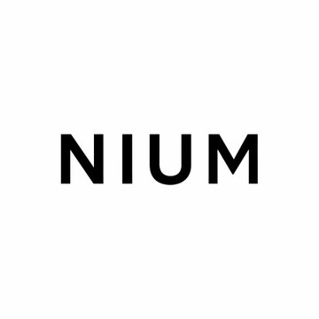 The image displays the bold, black text "NIUM" centered on a white background. This minimalist logo visually reinforces the post's mention of NIUM, a Ripple payments partner pursuing an IPO and expanding its use of XRP-based infrastructure.