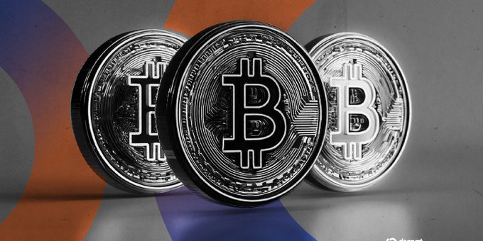 A close-up image of three physical Bitcoin tokens with the 'B' symbol arranged on a surface with orange and purple accents.