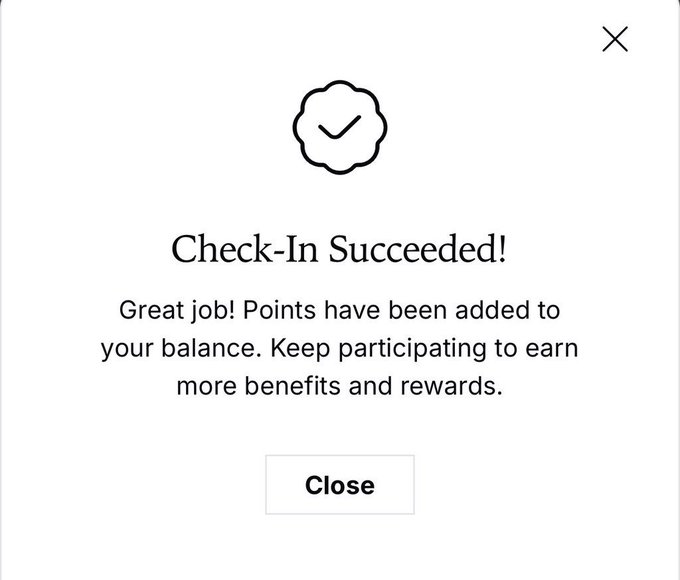A confirmation pop-up reading "Check-In Succeeded! Great job! Points have been added to your balance. Keep participating to earn more benefits and rewards." with a Close button, verifying the user's successful daily check-in on QuipNetwork.