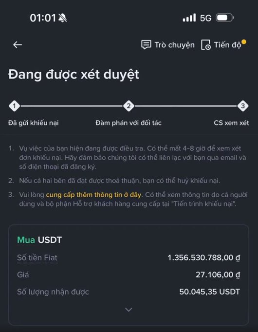 A Vietnamese-language mobile app screen showing a dispute/appeal status ('Đang được xét duyệt') with a 3-step progress tracker, and transaction details for buying USDT with 1,356,530,788 VND at a price of 27,106.00.