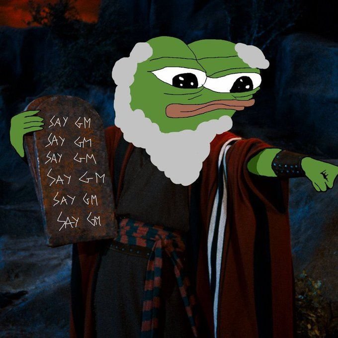 A meme combining the Pepe the Frog face with the iconic Moses 'Ten Commandments' pose, holding a stone tablet inscribed repeatedly with 'SAY GM'.