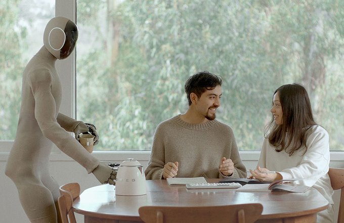 A humanoid robot serves coffee to a couple seated at a table, illustrating the post's vision of robotics as the next frontier for AI, with the brand "WEED" visible on the coffee maker—tying the futuristic scene to the AI/compute narrative behind $P0.