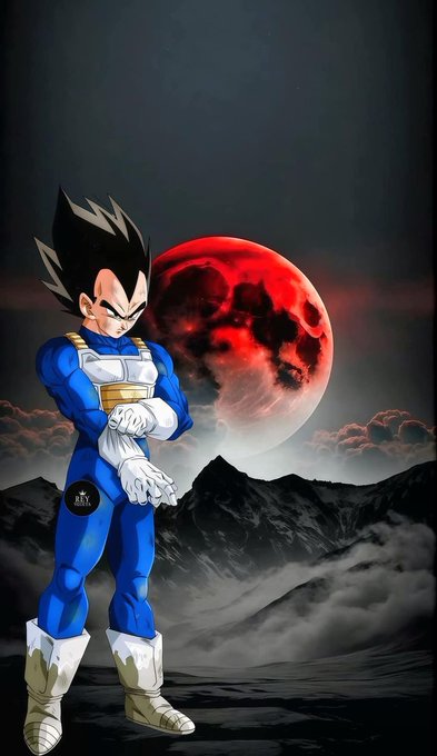 Fan art of Vegeta from Dragon Ball Z standing in his blue Saiyan armor with a red blood moon and misty mountains in the background.