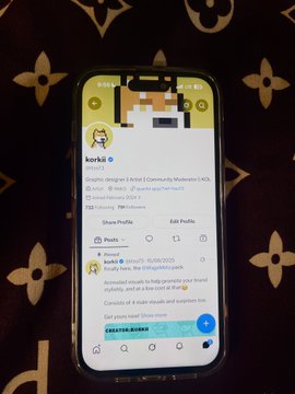 Phone screen showing a Twitter profile for 'korki' (@korkiboys), a graphic designer and artist affiliated with Community Moderator | #GG, with pixel art avatar.
