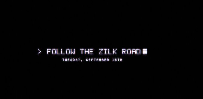 A black screen with white retro terminal-style text reading '> FOLLOW THE ZILK ROAD' and 'TUESDAY, SEPTEMBER 15TH'.