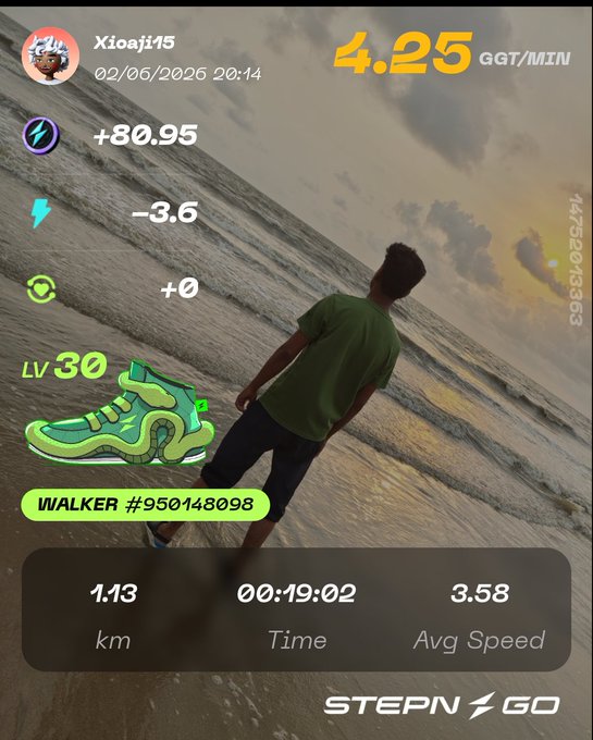 The image shows a person standing by the ocean at sunset, with their feet in the water. The photo captures this serene moment, emphasizing the beauty of nature and the tranquility that comes from spending time outdoors. The caption for the image reads "Tonight' @Stepnofficial session was more than just a walk. Standing by the ocean, watching the sun slowly disappearing behind the horizon, I was reminded that some of the best rewards can't be measured in GMT or GGT. A beautiful sunset." This message highlights the importance of taking time to appreciate and connect with nature, as well as the value of spending quality time outdoors for mental and emotional well-being.