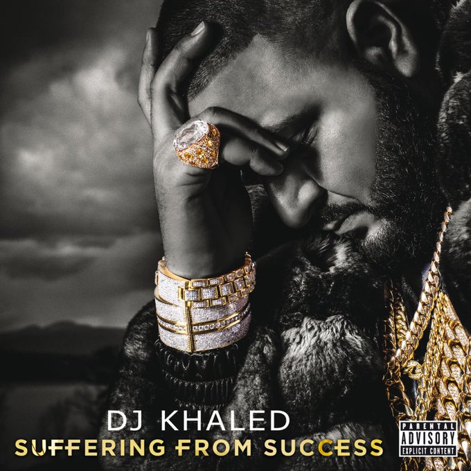 iced coffee with a gold ring on the cup, DJ Khaled's face and hands are shown in black and white against a black background.