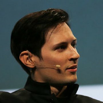 A side-profile photograph of Pavel Durov, the founder of Telegram, wearing a black zip-up jacket and a small headset microphone against a dark blue background.
