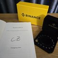 A handwritten card reads "BD Ventures, #2, Champion Star," alongside a Binance-branded envelope and a black Binance card, celebrating the team's recognition as a top performer at the Binance Campus Asia 2026 Gala Dinner.