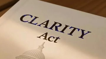 A document titled "CLARITY Act" rests on a desk beside the U.S. Capitol dome illustration, visually reinforcing the post's message about Senator Cynthia Lummis's push for bipartisan regulatory clarity that could reshape cryptocurrency and XRP's role in digital finance.