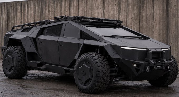 A matte-black, armored tactical vehicle with angular bodywork, oversized off-road tires, and a roof-mounted light bar is parked in front of a weathered wooden wall, embodying the rugged "Cybertumbler" aesthetic.