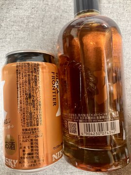 A can of Nikka Frontier highball and a bottle of Nikka Days whisky sit together on a surface, with visible Japanese labeling.