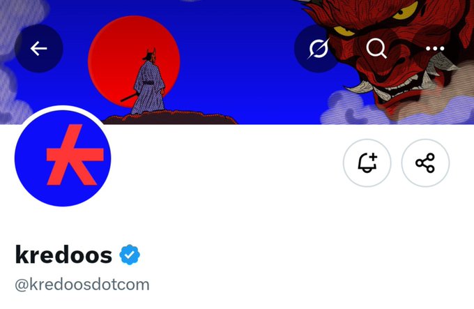 Twitter/X profile page for the verified account 'kredoos' (@kredoosdotcom), featuring a blue logo with a red 'K' and a banner depicting a samurai and a red demon mask.