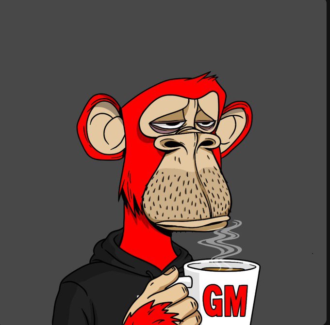 A cartoon illustration shows a red monkey wearing a black hoodie, looking tired while holding a steaming white mug labeled 'GM'.