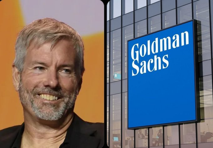 Split image shows Michael Saylor smiling on the left alongside a prominent blue "Goldman Sachs" sign on a building, visually representing the bank's growing $558M investment in Saylor's MicroStrategy ($MSTR) and its Bitcoin-focused strategy.